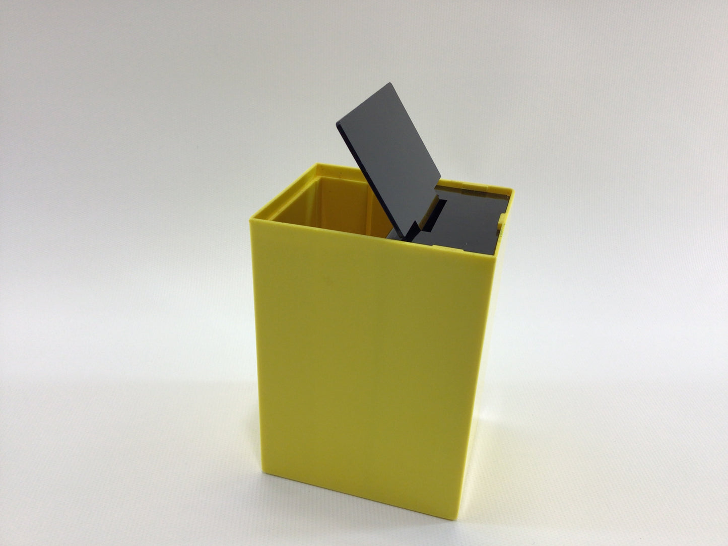 Bottoms Up Mid Century Novelty Storage Container Box Yellow and Black Hard Plastic Weighted Trap Door Bottom