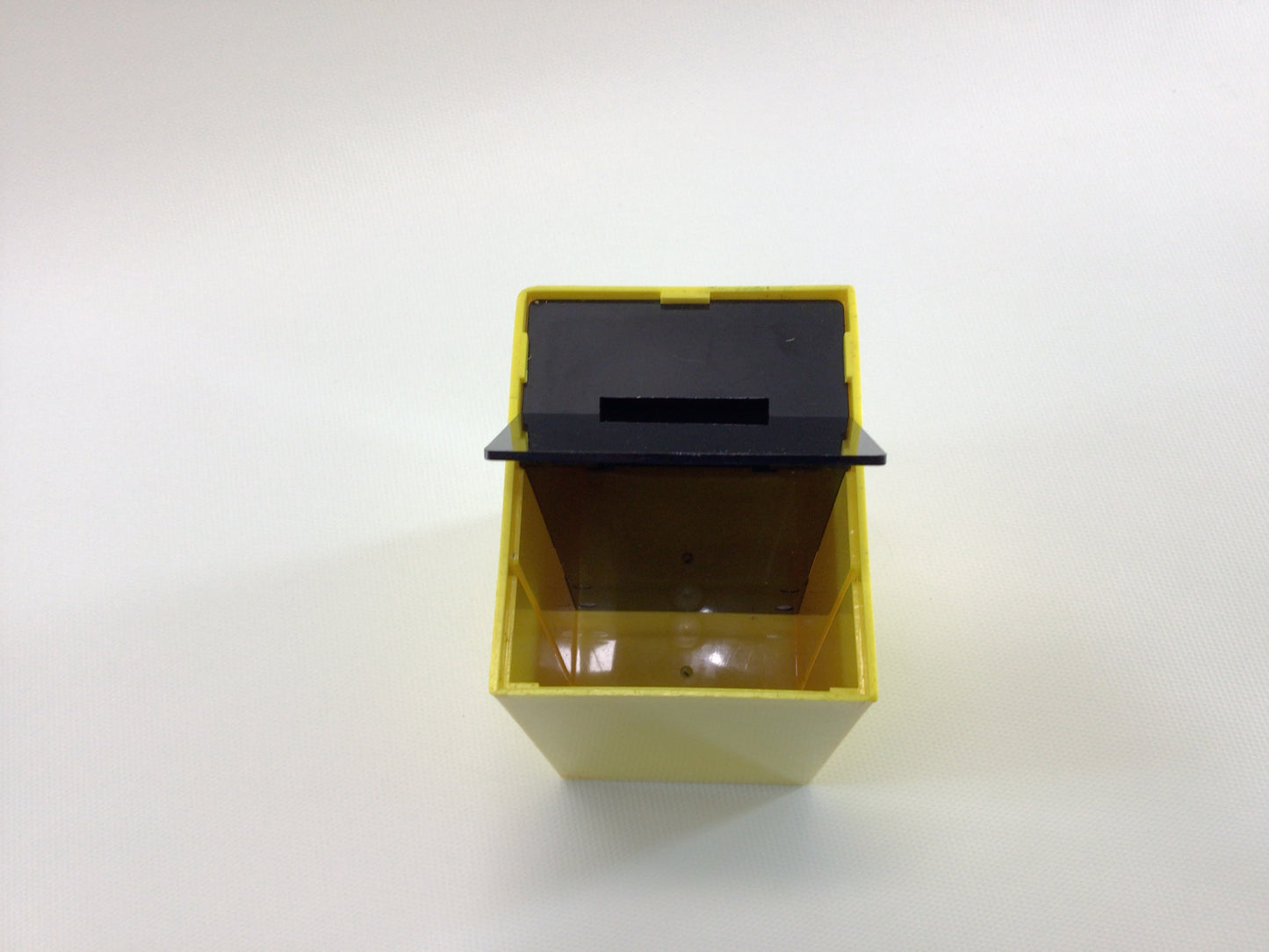 Bottoms Up Mid Century Novelty Storage Container Box Yellow and Black Hard Plastic Weighted Trap Door Bottom