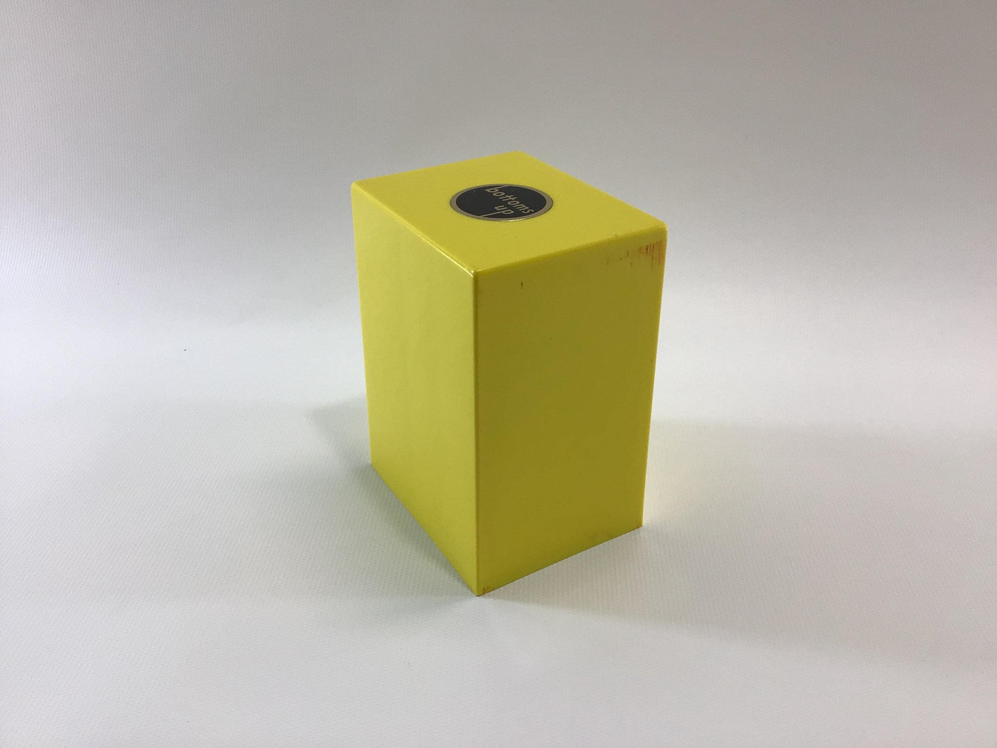 Bottoms Up Mid Century Novelty Storage Container Box Yellow and Black Hard Plastic Weighted Trap Door Bottom