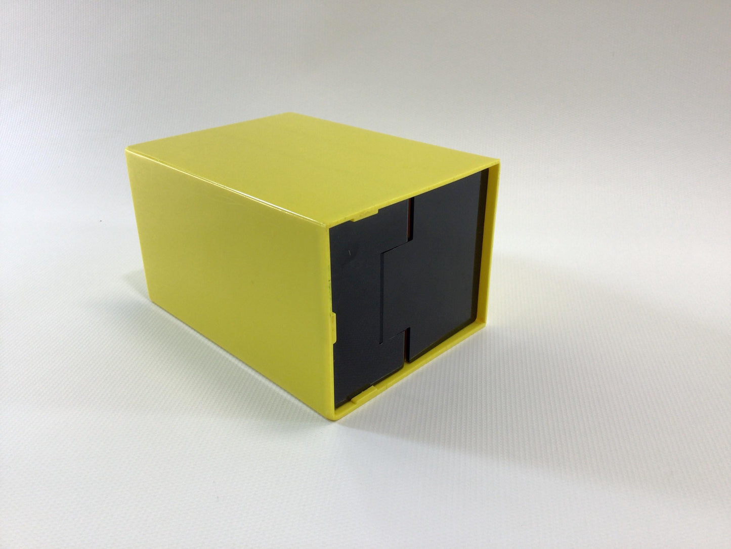Bottoms Up Mid Century Novelty Storage Container Box Yellow and Black Hard Plastic Weighted Trap Door Bottom