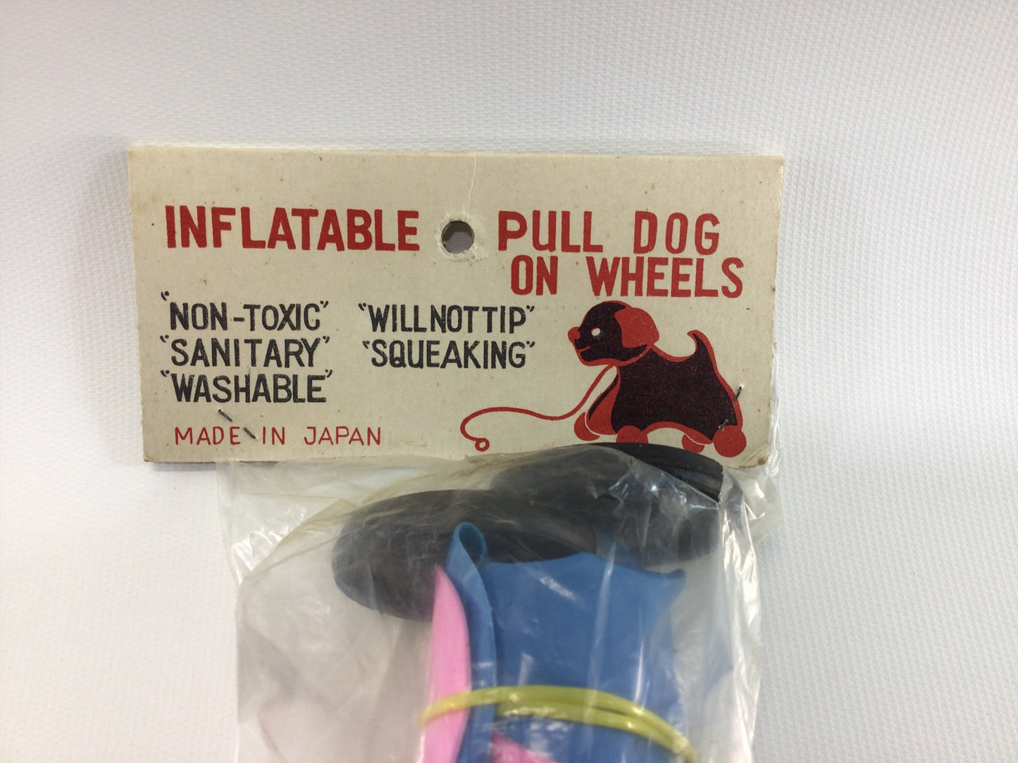 Vintage Pull Dog Toy Inflatable Plastic Pink and Blue Toddler Pretend Companion Squeaking Floppy Ears Black Wheels Washable Original Package