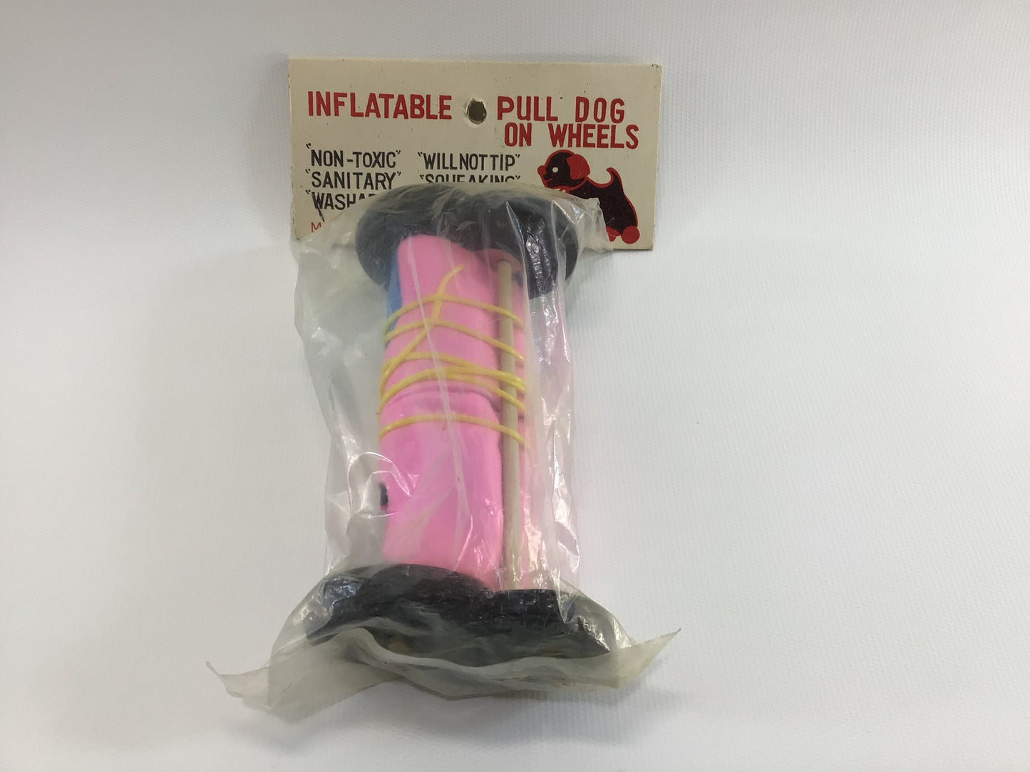 Vintage Pull Dog Toy Inflatable Plastic Pink and Blue Toddler Pretend Companion Squeaking Floppy Ears Black Wheels Washable Original Package