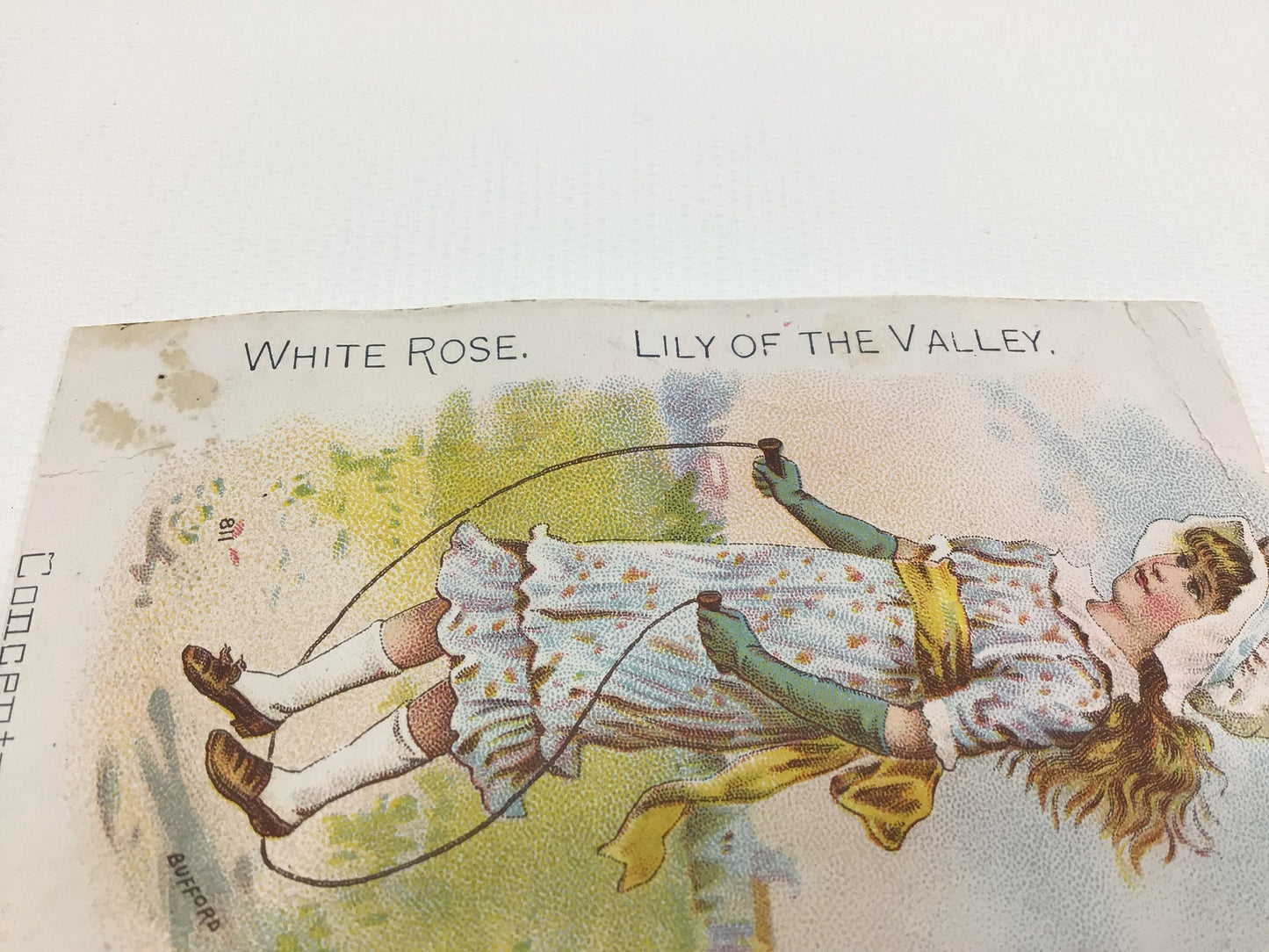 Antique White Rose Lily of the Valley Trade Card Girl Swinging Victorian Advertising Ephemera