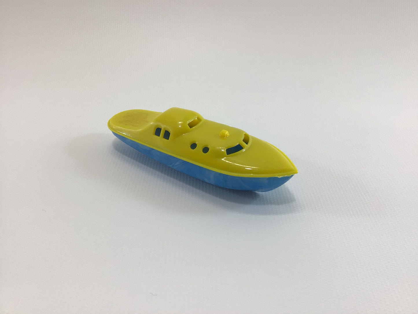 Banner 4" Toy Boat Vintage Hard Plastic Speedboat Yellow with Blue Hull