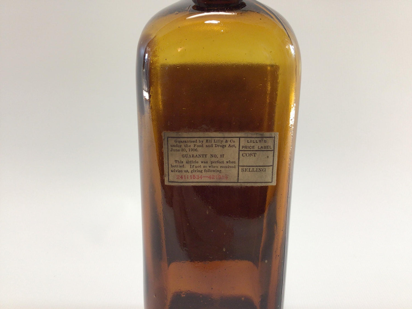 Antique Home Remedies Cork Top Paper Label Bottle Anti-Asthmatic Elixir Eli Lilly Company Indianapolis