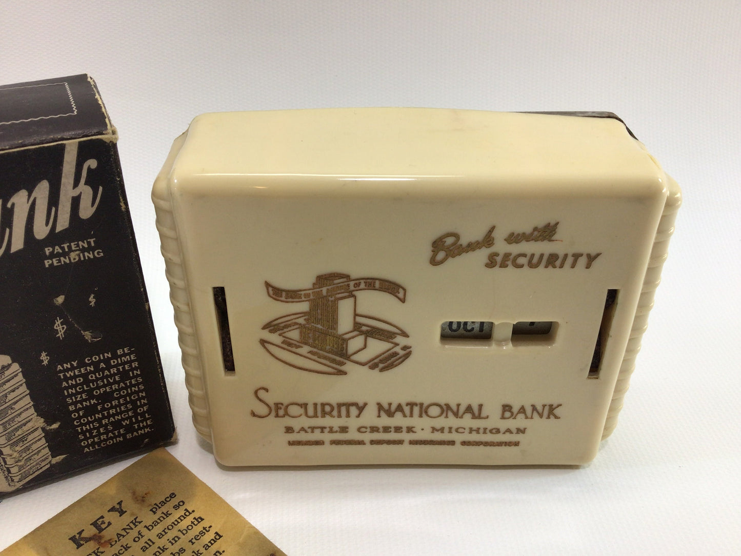 Calendar Coin Bank Vintage Advertising Battle Creek Michigan Gerett Allcoin